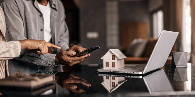 Homeowner calculating a refinance break even point using mortgage costs