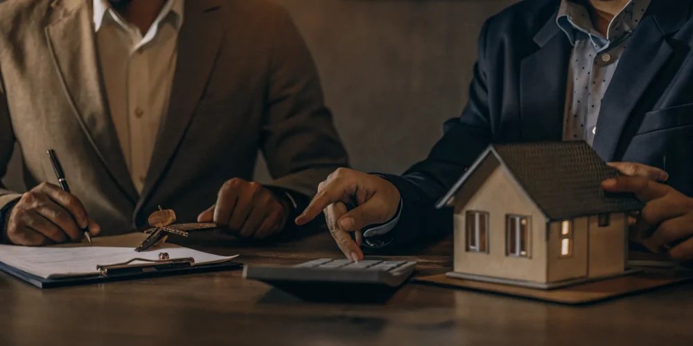 A clean illustration of mortgage document verification with pay stubs, tax forms, and a calculator on a desk with a house key