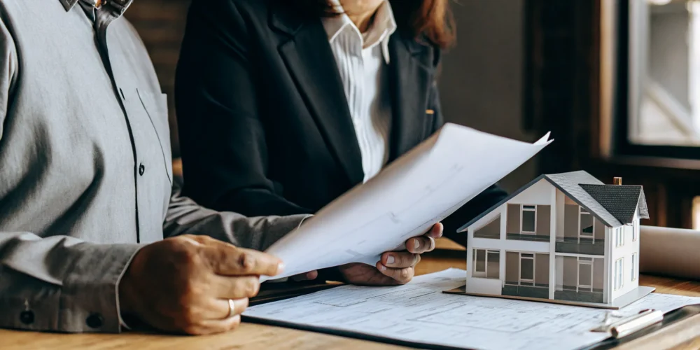 Modern home buyer reviewing mortgage documents and financial charts showing down payment options
