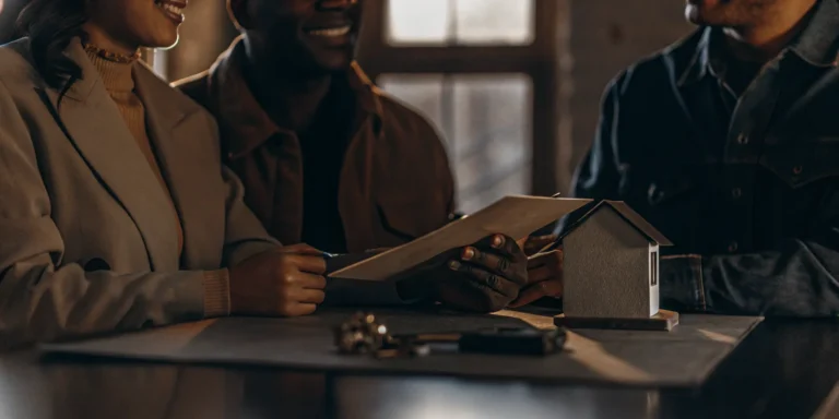 Homebuyers reviewing mortgage documents with a loan officer