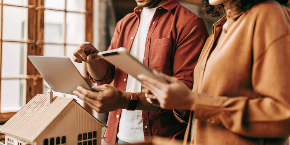 Two adults reviewing a mortgage rate comparison together, private and approachable fintech setting